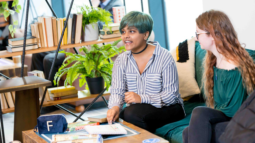 Two students in conversation, smiling