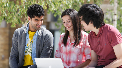 Three students studying outside