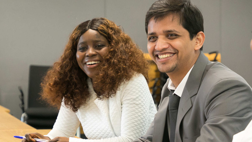 Two students smiling
