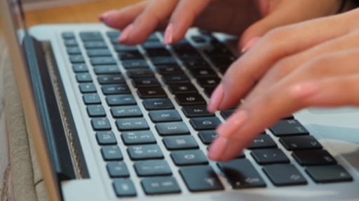 Person typing on laptop