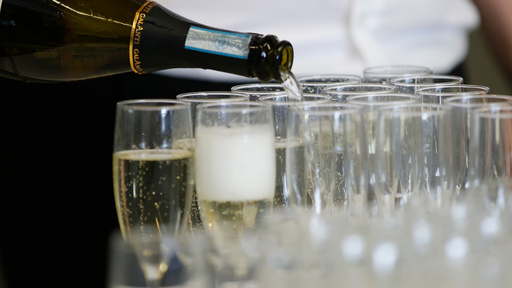 Glasses being filled with prosecco
